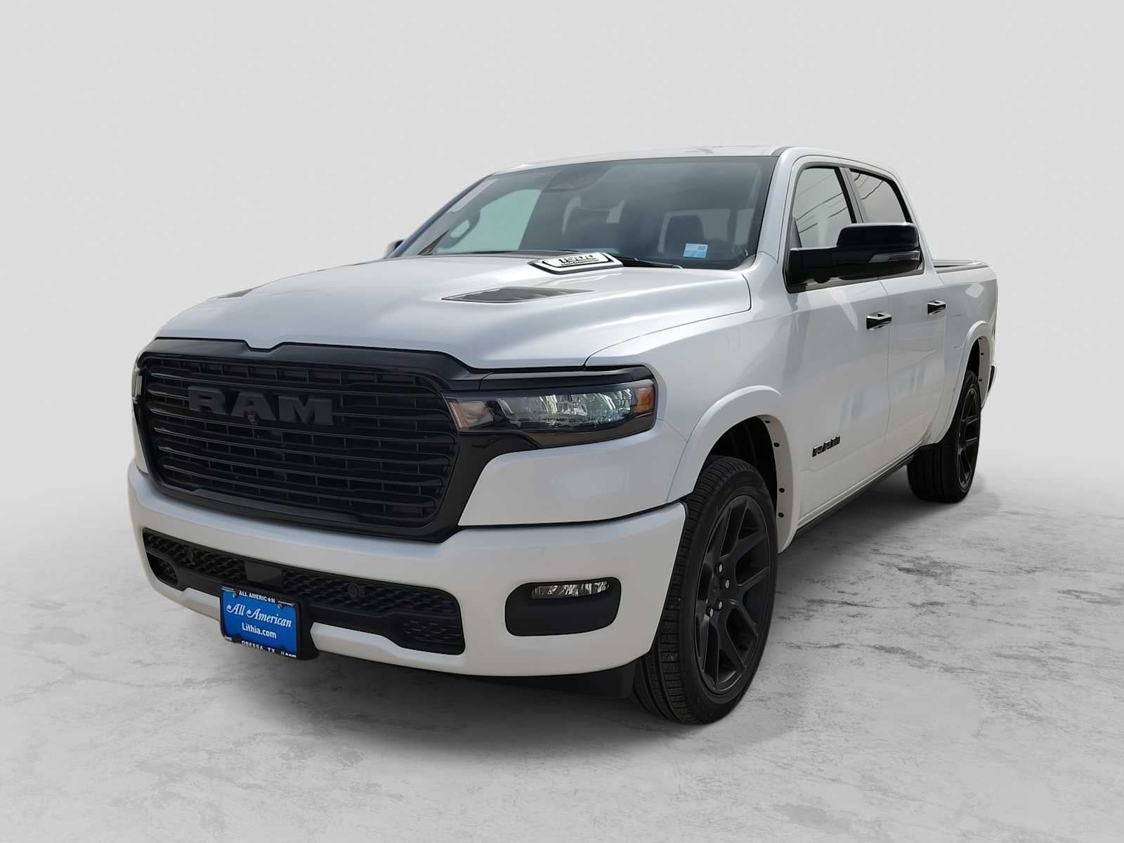2026 RAM 1500 RAM 1500 LARAMIE CREW CAB 4X2 5'7' BOX in Ivory White Tri-Coat Pearl-Coat Exterior Paint — front three-quarter view