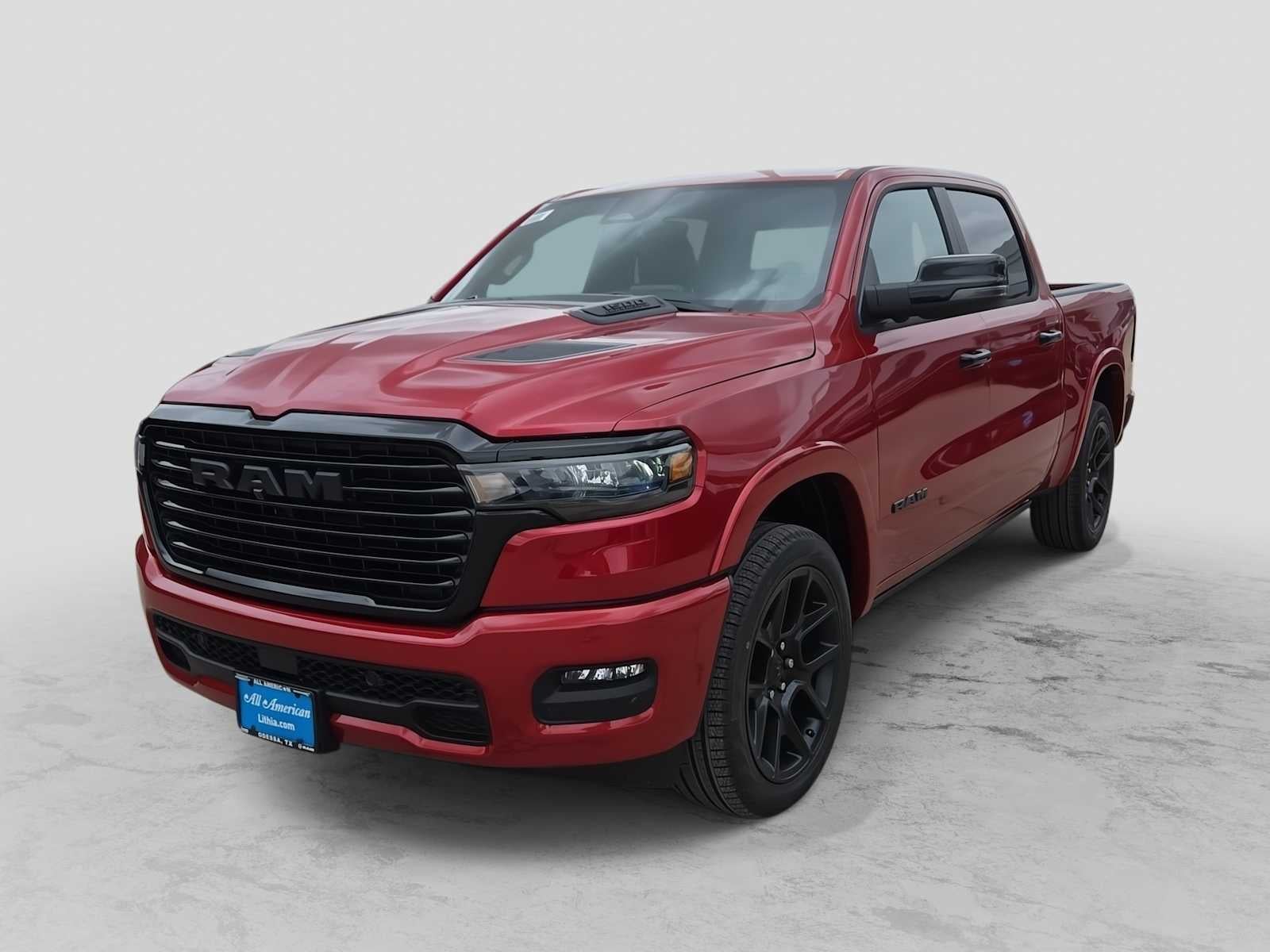 2026 RAM 1500 RAM 1500 LARAMIE CREW CAB 4X4 5'7' BOX in Molten Red Pearl-Coat Exterior Paint — front three-quarter view