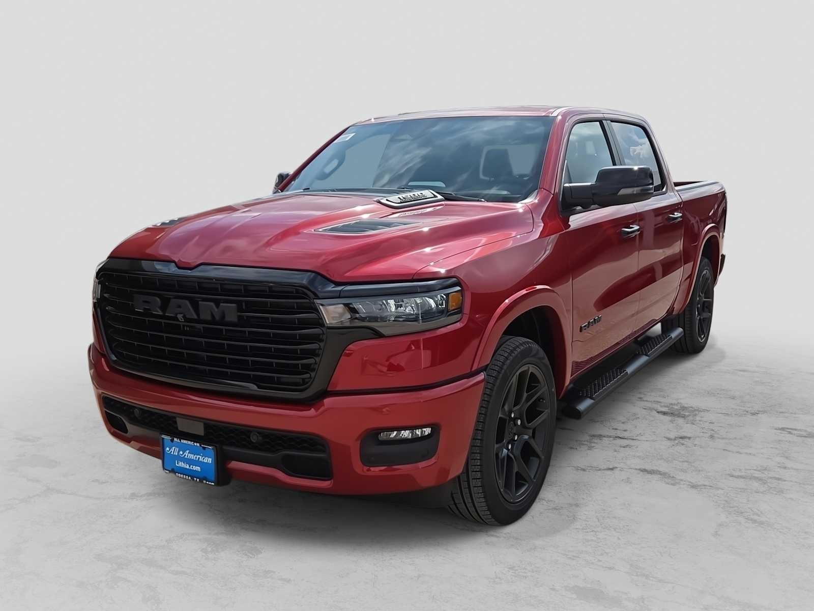2026 RAM 1500 RAM 1500 LARAMIE CREW CAB 4X4 5'7' BOX in Molten Red Pearl-Coat Exterior Paint — front three-quarter view