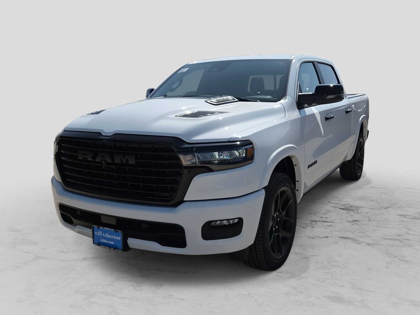 2026 RAM 1500 RAM 1500 LARAMIE CREW CAB 4X4 5'7' BOX in Bright White Clear-Coat Exterior Paint — front three-quarter view