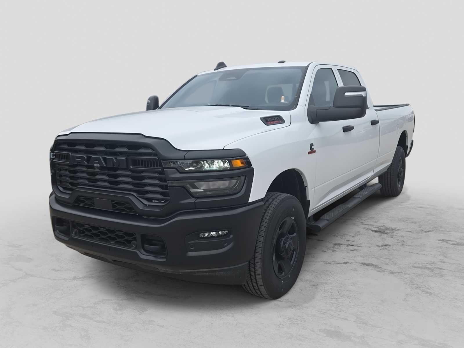 2025 RAM 3500 RAM 3500 TRADESMAN CREW CAB 4X4 8' BOX in Bright White Clear-Coat Exterior Paint — front three-quarter view