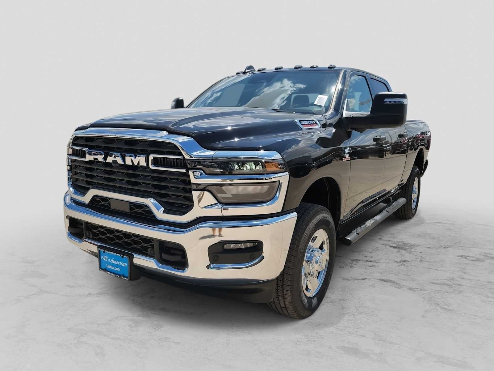 2026 RAM 2500 RAM 2500 TRADESMAN CREW CAB 4X4 6'4' BOX in Diamond Black Crystal Pearl-Coat Exterior Paint — front three-quarter view