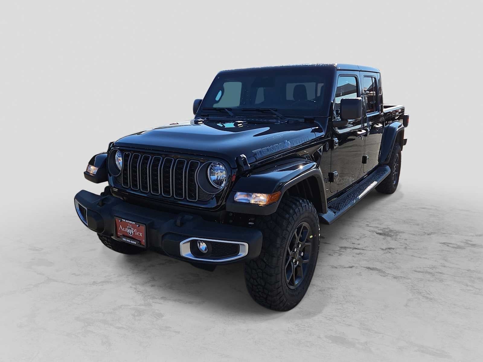 2026 Jeep Gladiator GLADIATOR TEXAS TRAIL 4X4 in Black Clear-Coat Exterior Paint — front three-quarter view