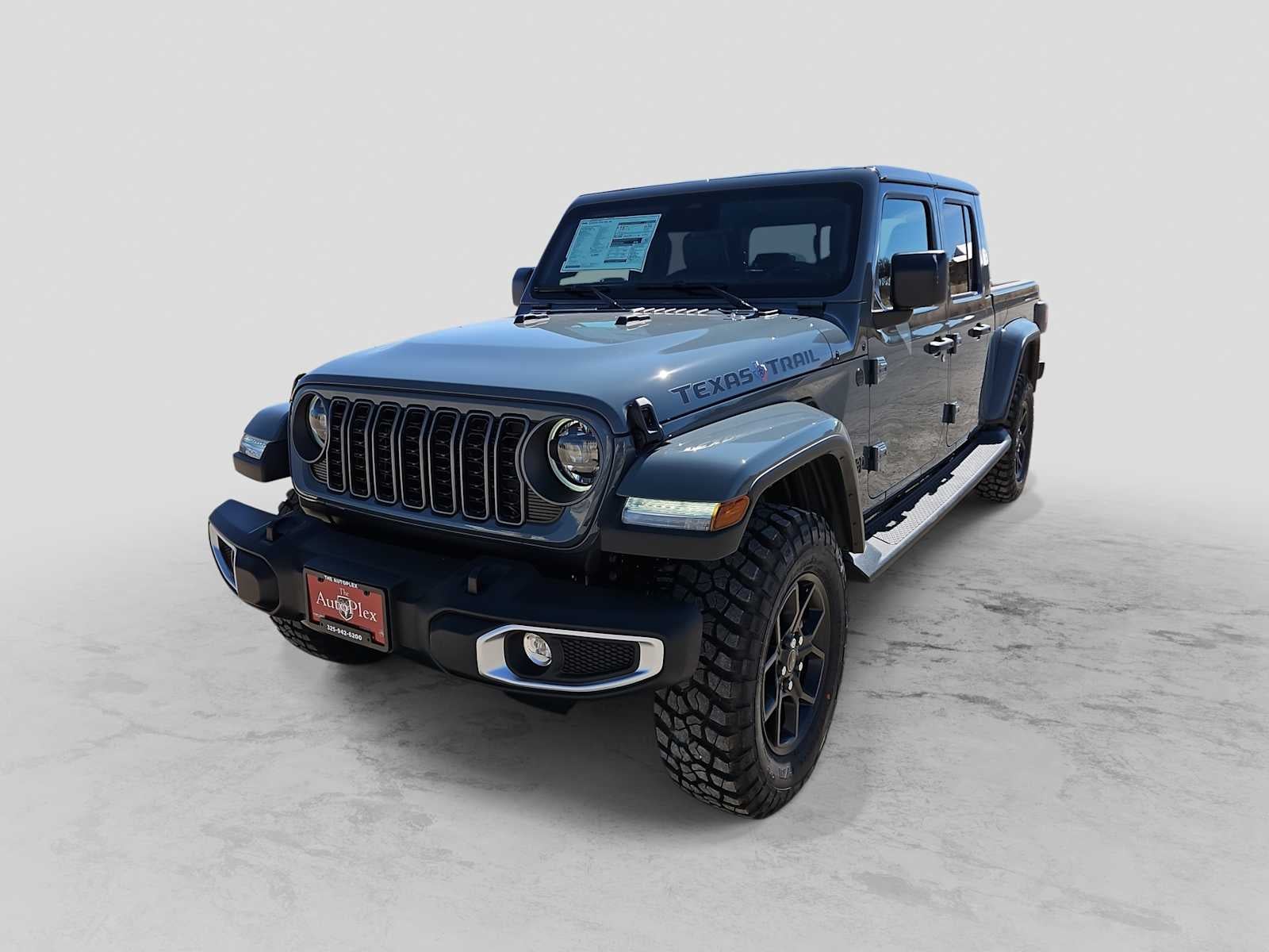 2026 Jeep Gladiator GLADIATOR TEXAS TRAIL 4X4 in Anvil Clear-Coat Exterior Paint — front three-quarter view