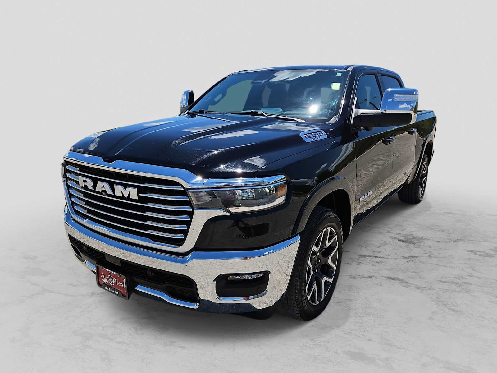 2025 RAM 1500 Laramie Crew Cab 4x4 5'7' Box in Diamond Black Crystal Pearlcoat — front three-quarter view