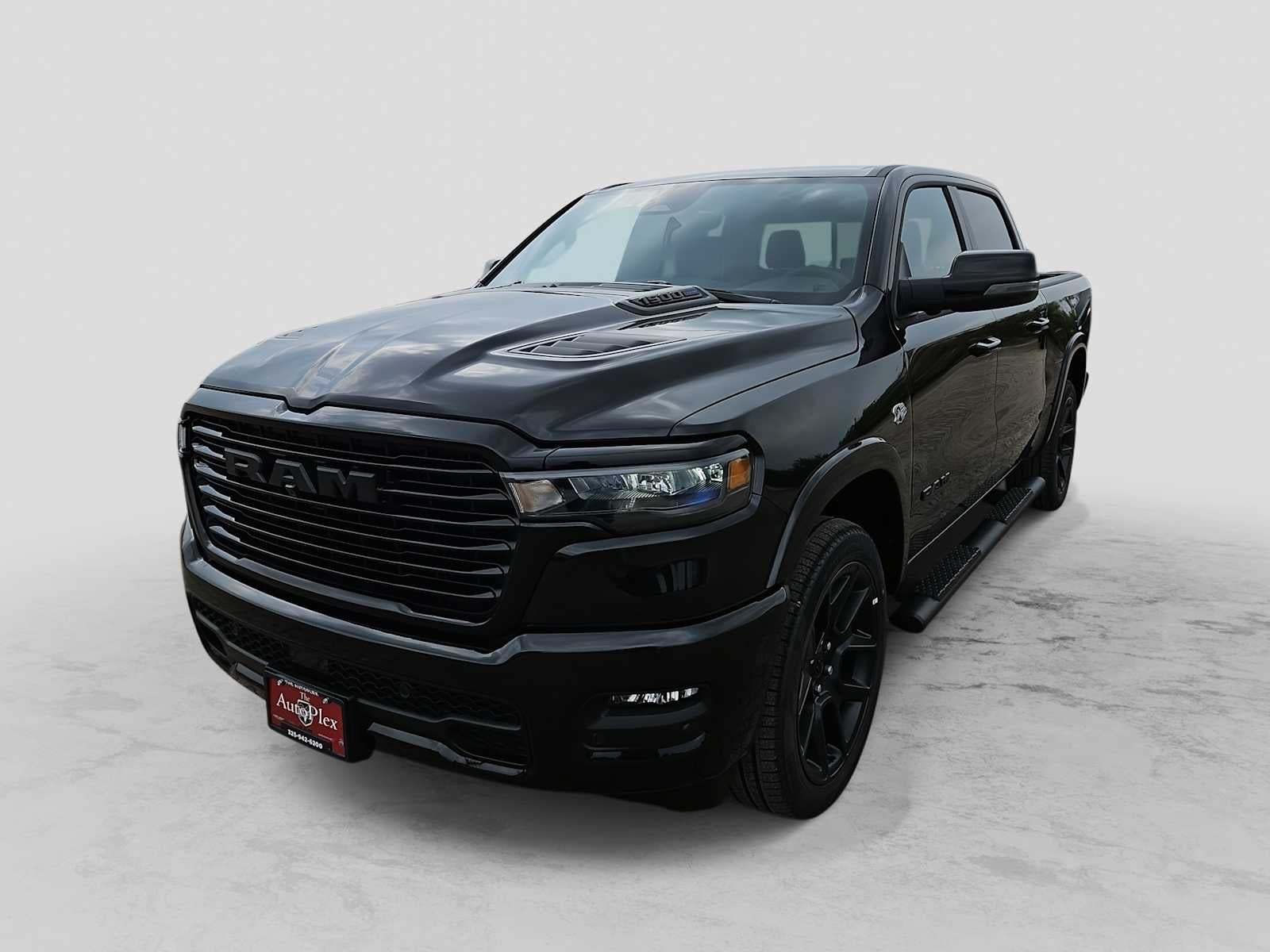 2026 RAM 1500 RAM 1500 LARAMIE CREW CAB 4X4 5'7' BOX in Diamond Black Crystal Pearl-Coat Exterior Paint — front three-quarter view