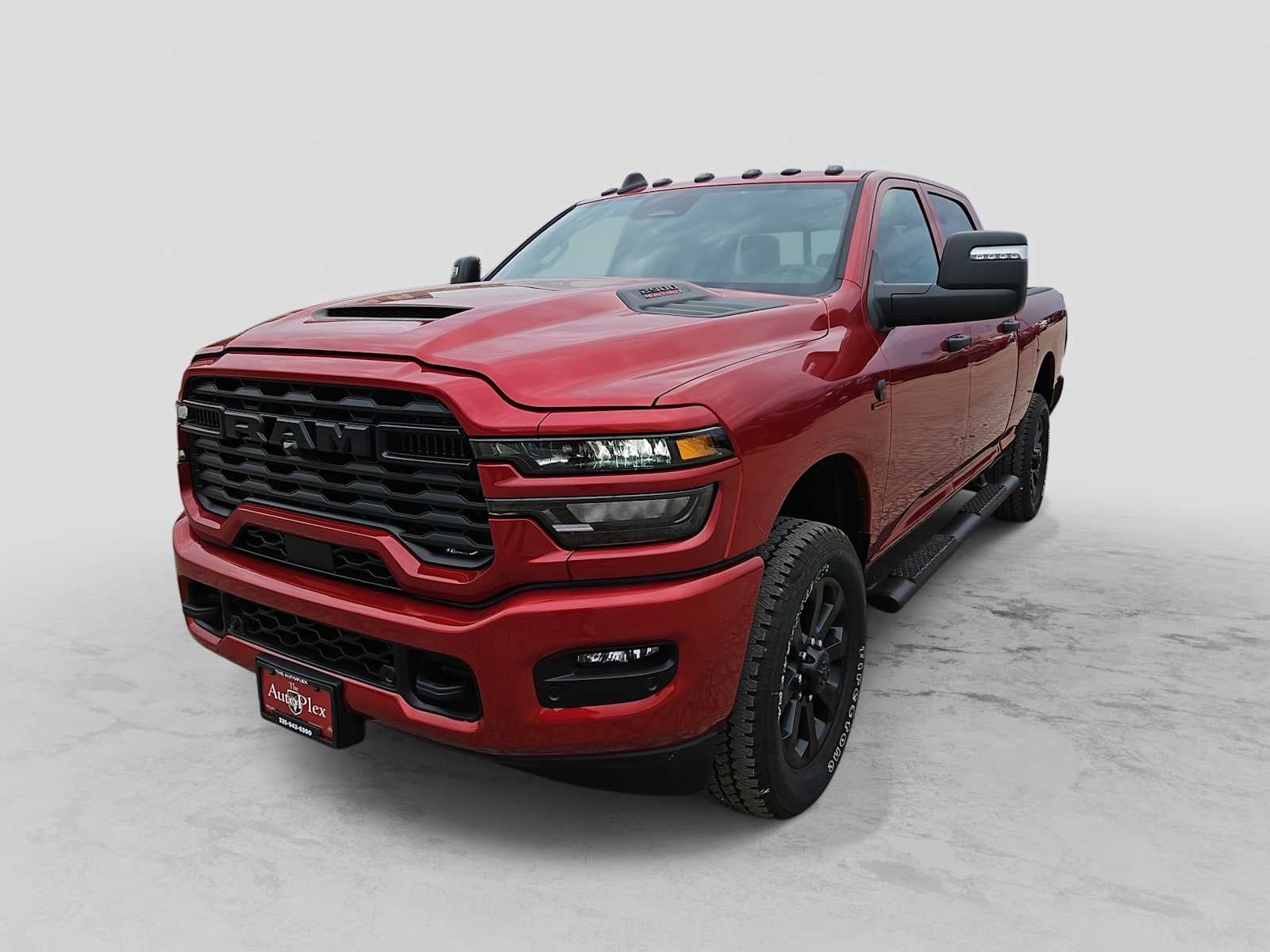 2026 RAM 2500 RAM 2500 BLACK EXPRESS CREW CAB 4X4 6'4' BOX in Molten Red Pearl-Coat Exterior Paint — front three-quarter view