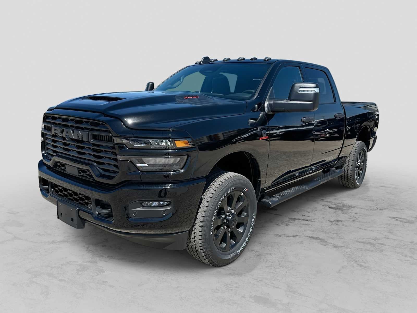 2026 RAM 2500 RAM 2500 BLACK EXPRESS CREW CAB 4X4 6'4' BOX in Diamond Black Crystal Pearl-Coat Exterior Paint — front three-quarter view