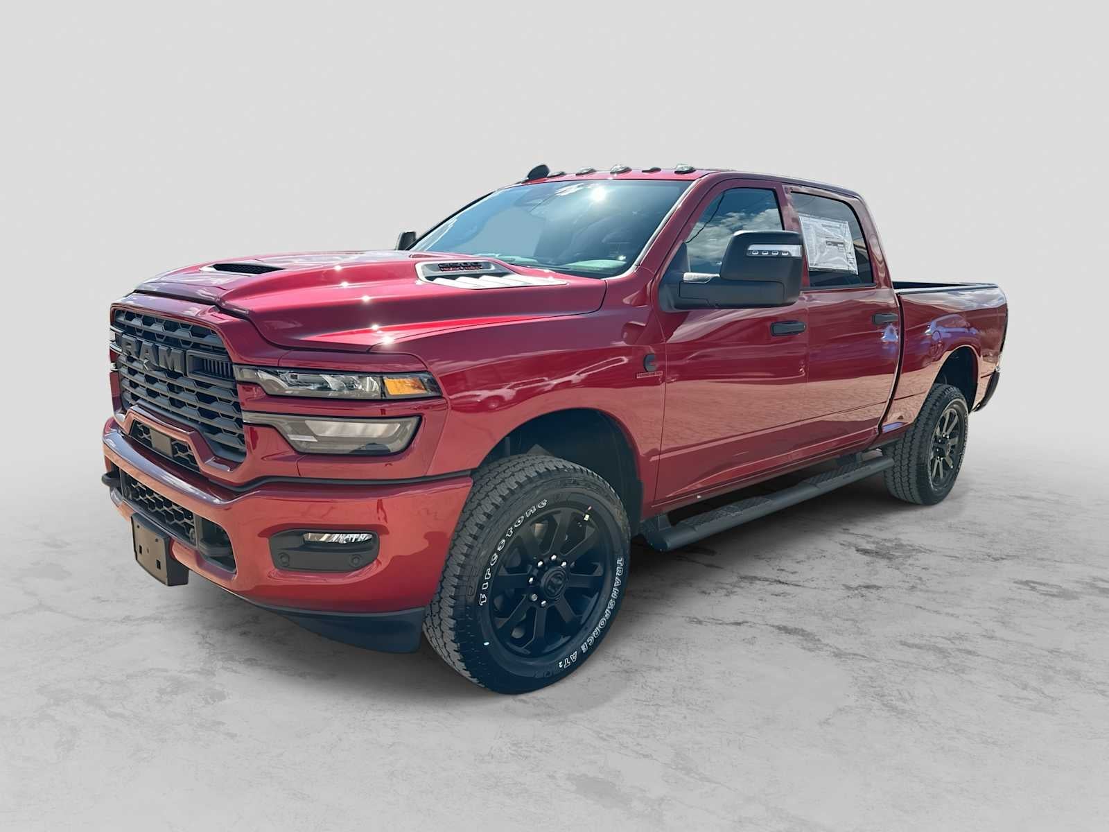 2026 RAM 2500 RAM 2500 BLACK EXPRESS CREW CAB 4X4 6'4' BOX in Molten Red Pearl-Coat Exterior Paint — front three-quarter view
