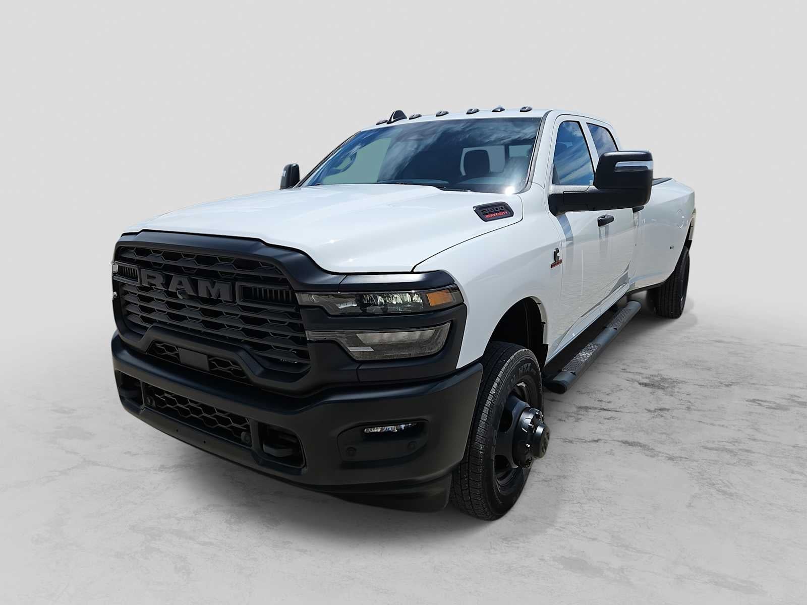 2026 RAM 3500 RAM 3500 TRADESMAN CREW CAB 4X4 8' BOX in Bright White Clear-Coat Exterior Paint — front three-quarter view