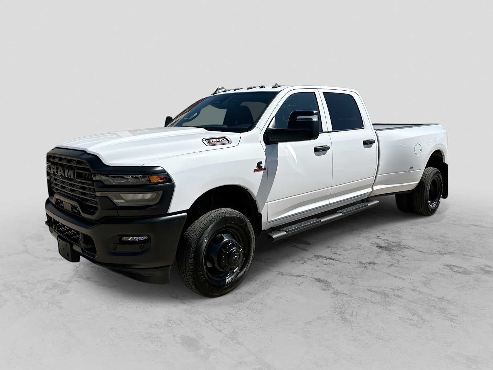 2026 RAM 3500 RAM 3500 TRADESMAN CREW CAB 4X4 8' BOX in Bright White Clear-Coat Exterior Paint — front three-quarter view