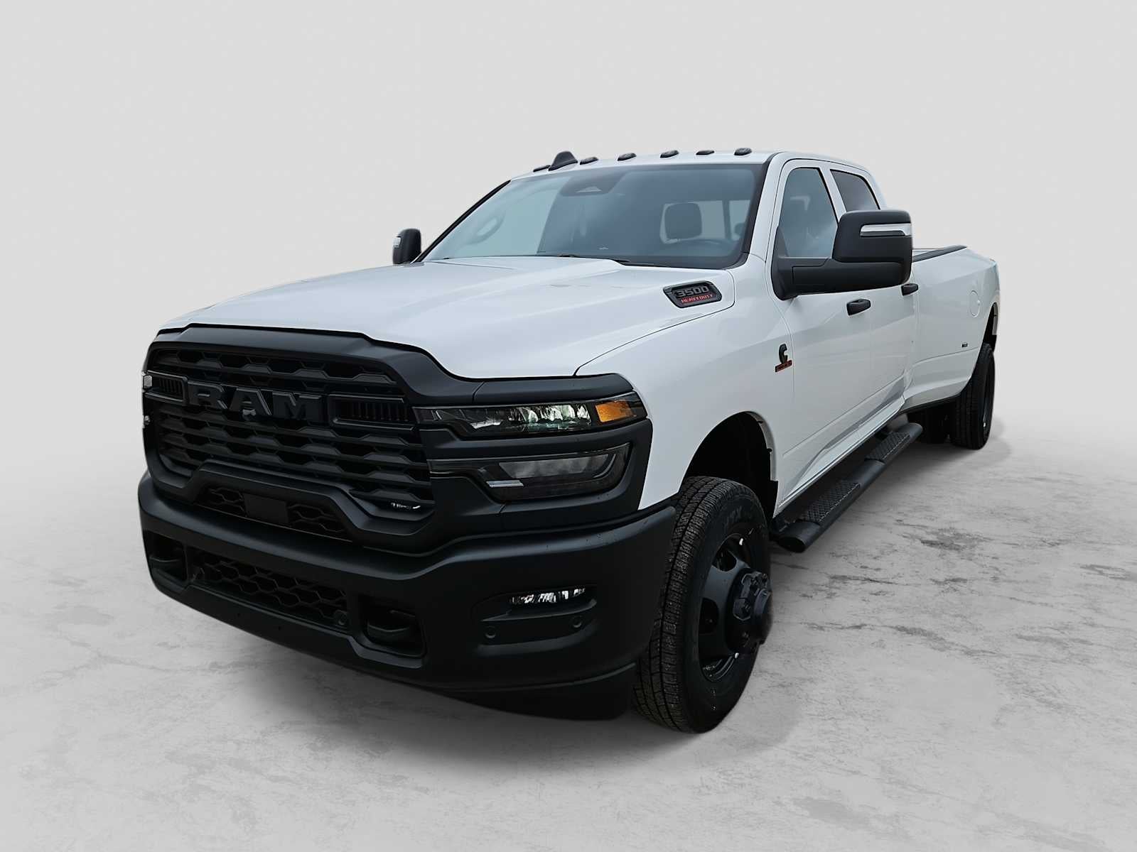 2026 RAM 3500 RAM 3500 TRADESMAN CREW CAB 4X4 8' BOX in Bright White Clear-Coat Exterior Paint — front three-quarter view
