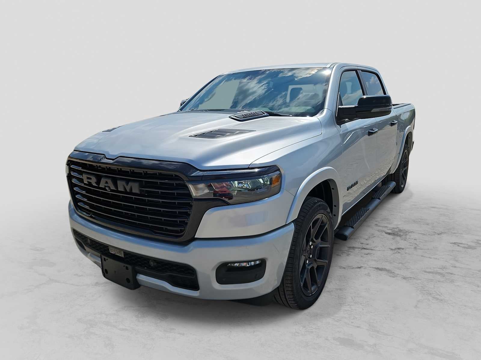 2026 RAM 1500 RAM 1500 LARAMIE CREW CAB 4X4 5'7' BOX in Silver Zynith Exterior Paint — front three-quarter view