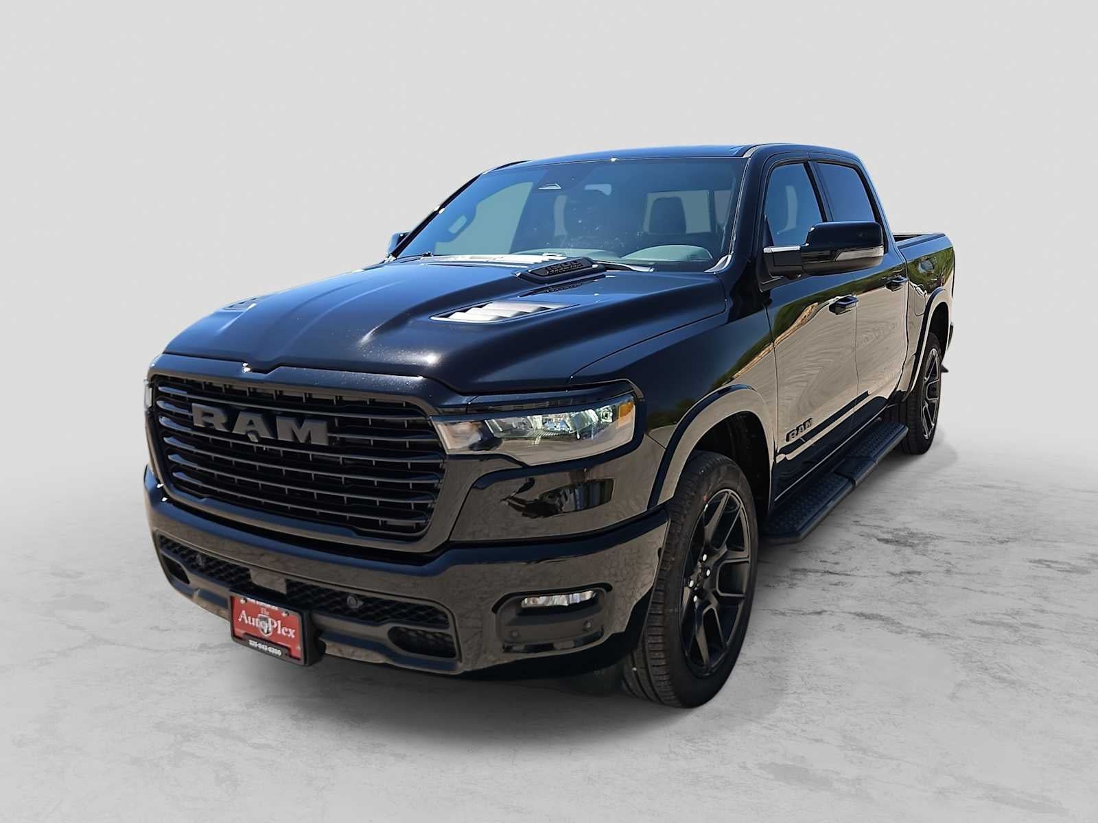2026 RAM 1500 RAM 1500 LARAMIE CREW CAB 4X4 5'7' BOX in Diamond Black Crystal Pearl-Coat Exterior Paint — front three-quarter view