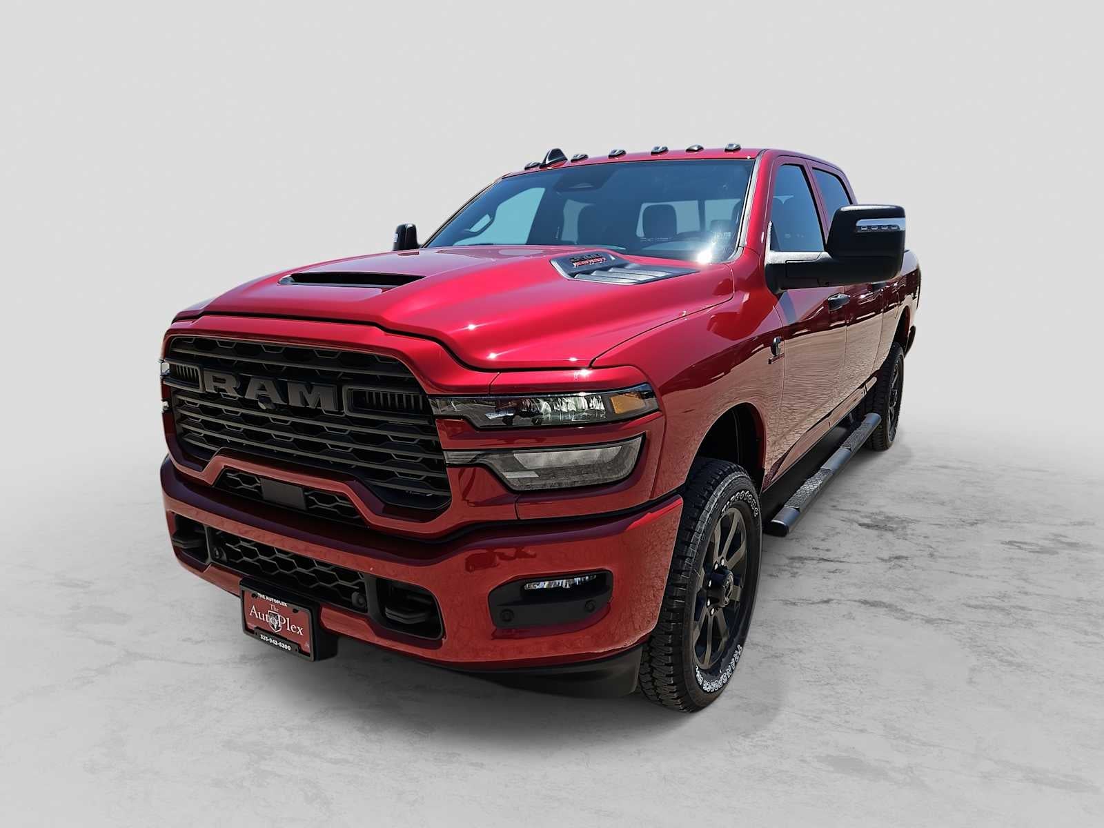 2026 RAM 2500 RAM 2500 BLACK EXPRESS CREW CAB 4X4 6'4' BOX in Molten Red Pearl-Coat Exterior Paint — front three-quarter view